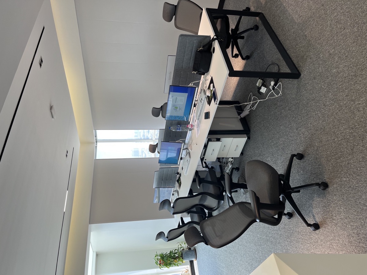 Team workspace with desks and monitors